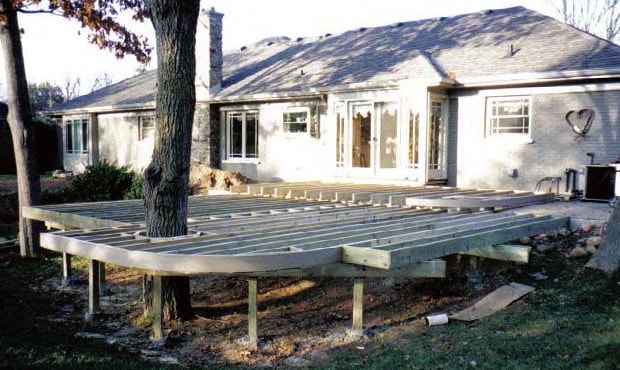 Deck sub-structure framed around a tree.