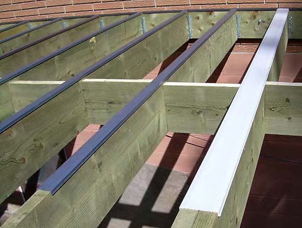 Deck sub-structure showing joist cap on single and double joists to protect from water damage.