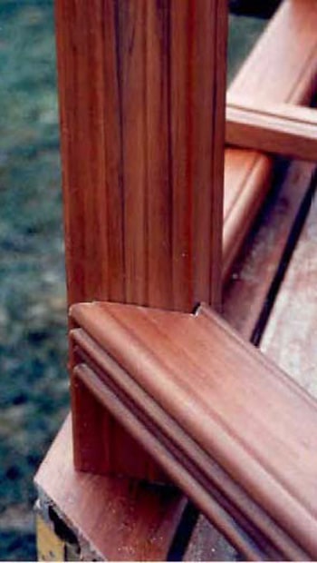 Railing notched to fit to a corner post on a 45 degree corner