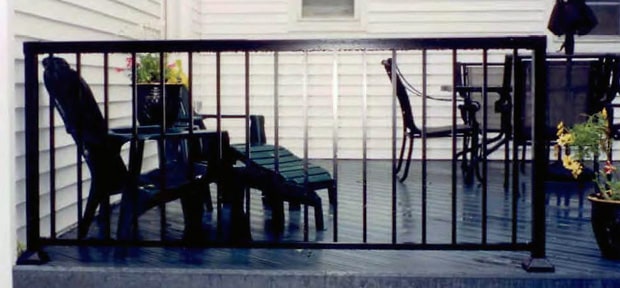 Deck with a black aluminum railing.