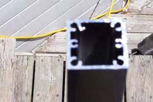 Top of aluminum rail post without rail clip attached.