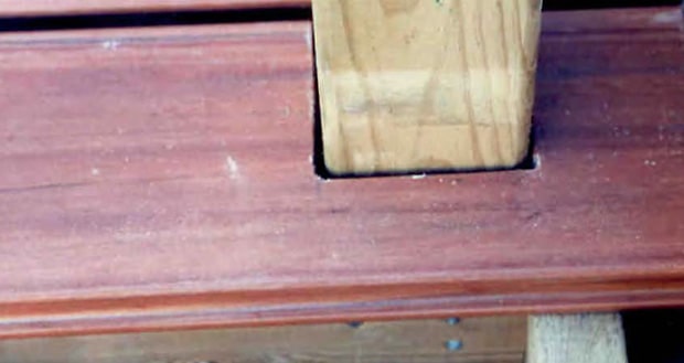 Deck board scribed around a corner post.