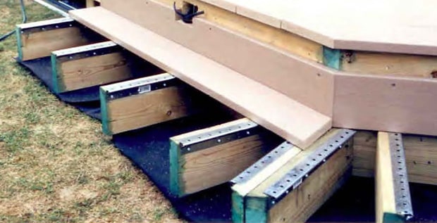 Deck joists with Shadoe Track hidden deck fastening system to mitigate water damage.
