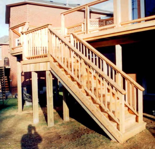 Stairs, with a landing to change direction, from a high deck.