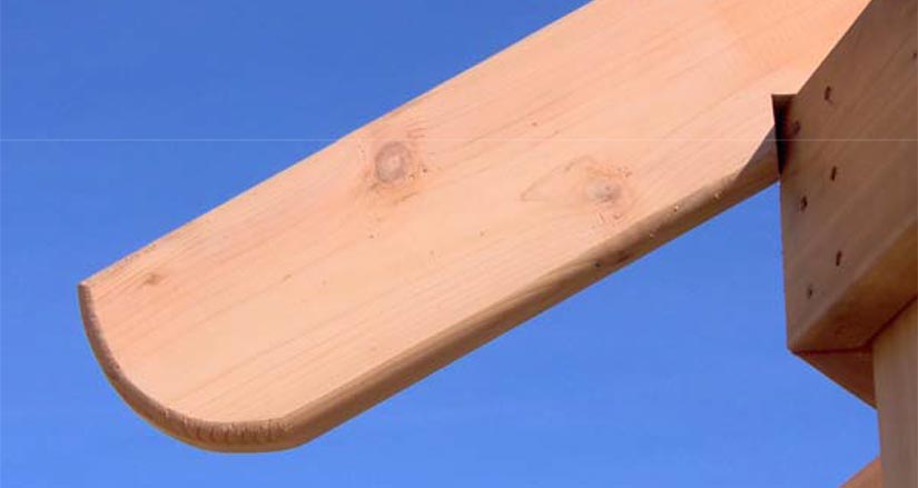 Rounded, or decorative rafter ends are an alternative to installing fascia board.