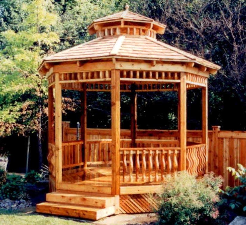 Completed gazebo with decorative trim below roof structure.