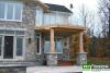 House with high medium sized single level cedar deck.