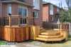 Large 2-level deck with a bench and planter boxes.